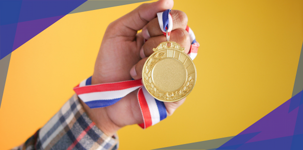 A clenched fist holding a gold medal to symbolize the high quality of a good app
